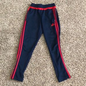 Red and blue adidas pants